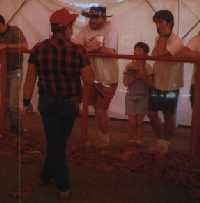 This idiot is in a snake pen with hundreds of snakes striking him!